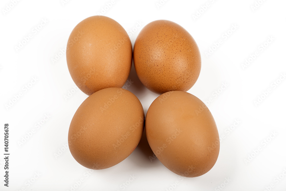 Four brown eggs on white background. Isolated. Four brown eggs on white background. Isolated.