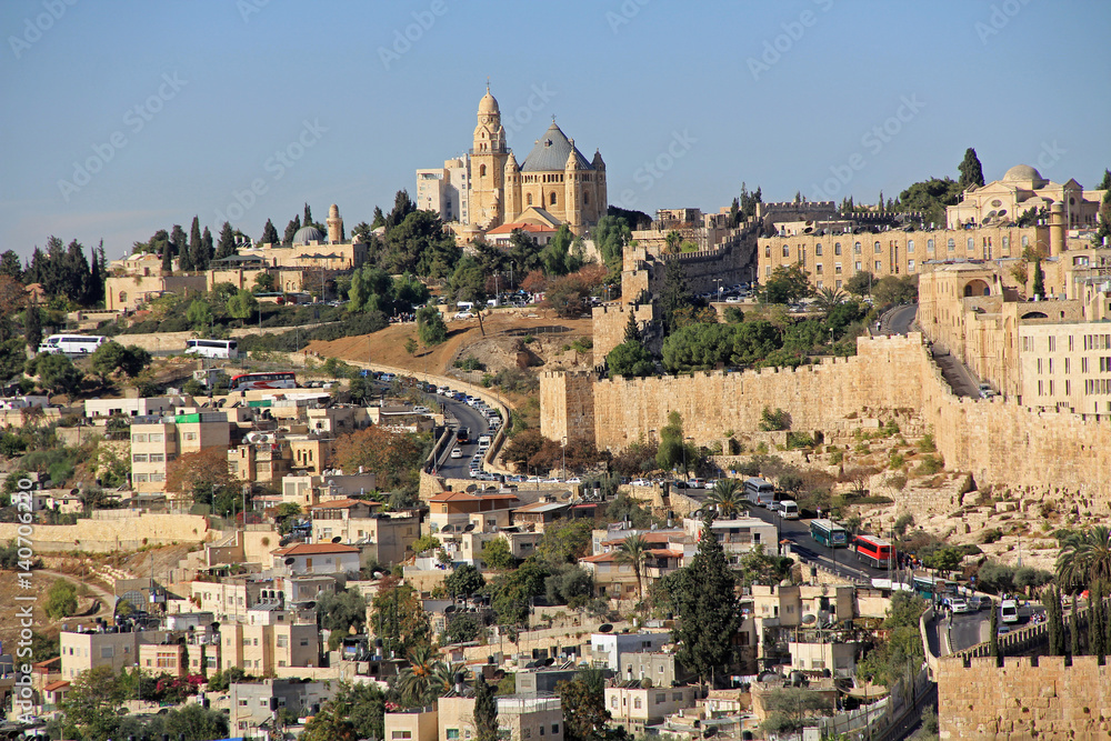 Dormition Abby and Old City Walls in a panoramic view of Jerusalem from the Mount of Olives beside the Kidron Valley.