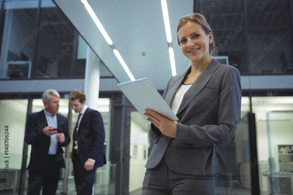 Businesswoman using digital tablet at office Businesswoman using digital tablet at office