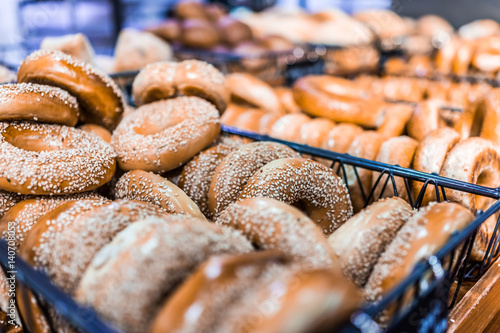 Closeup of many bagels in bakery photo