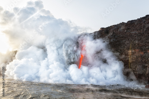 Explosion of ash and debris at Kamokuna entry Hawaii as fire hose of lava pours into ocean