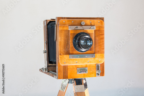 Old vintage big studio camera made of wood and metal on white background close up