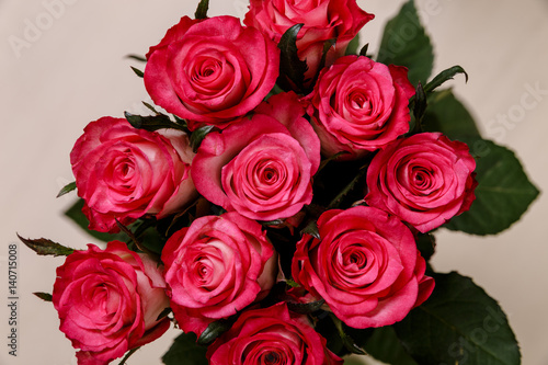 Pink roses background. Valentines day or 8 march floral gift. Bouquet of fresh natural flowers.