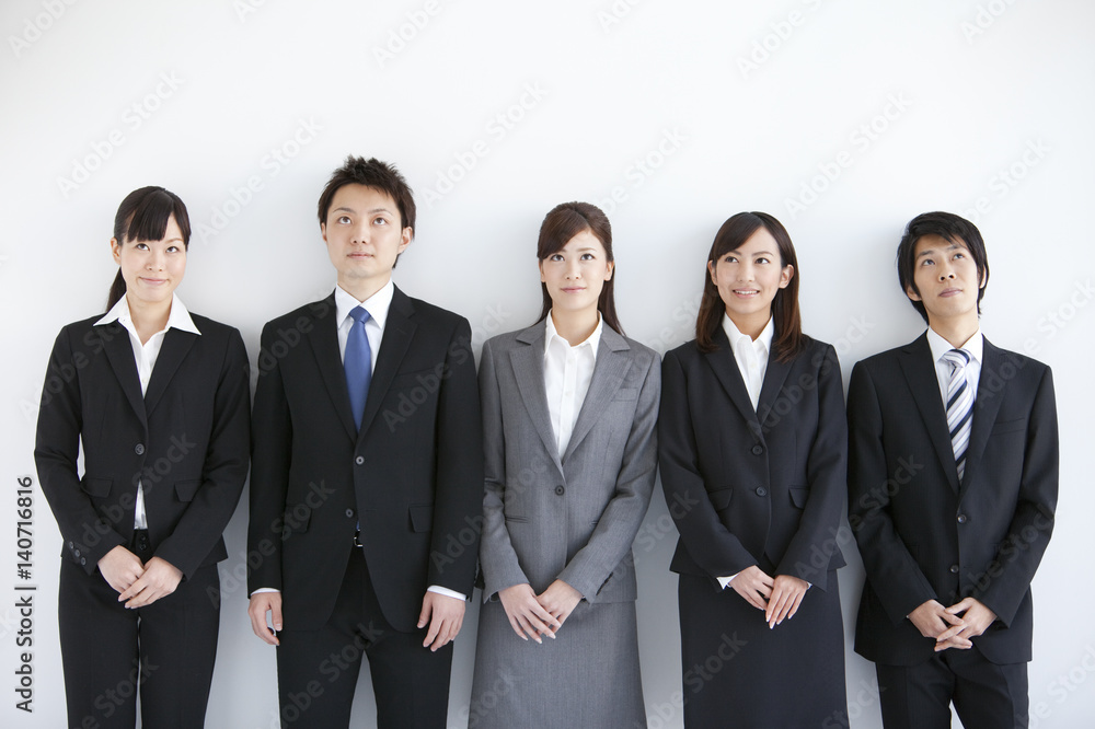 Young business people looking up Young business people looking up