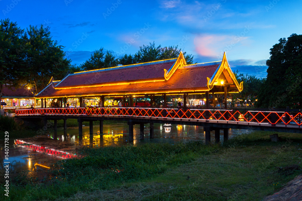Fototapeta premium Bright bridge over Siem Reap river at dusk. Siem Reap, Cambodia