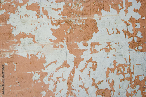 Weathered wall painted in light brown color