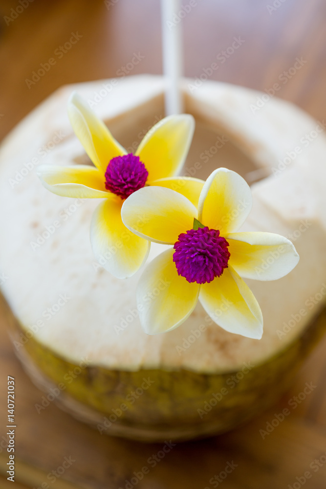 Fresh coconut beverage with flowers Fresh coconut beverage with flowers