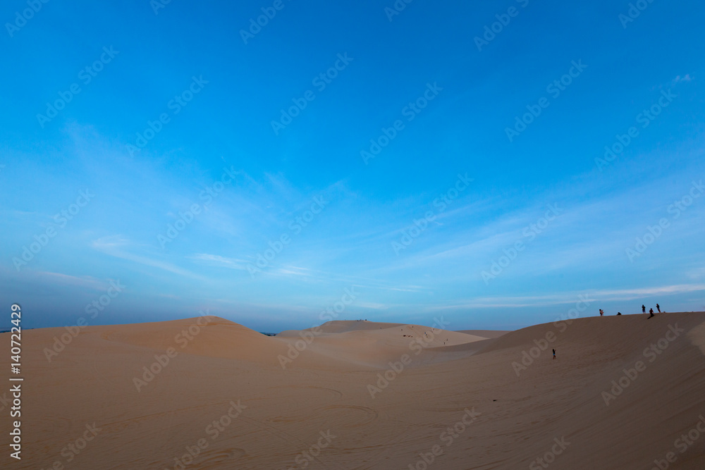 Group of people on white sand dunes - Mui Ne, Vietnam
