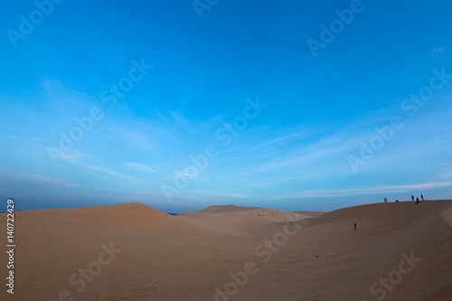 Fototapeta Naklejka Na Ścianę i Meble -  Group of people on white sand dunes - Mui Ne, Vietnam