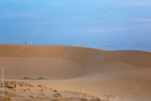 Intrepid Traveler on white sand dunes - Mui Ne, Vietnam