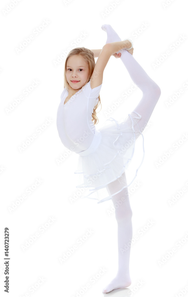 Fototapeta premium Little gymnast carefully bends your body.