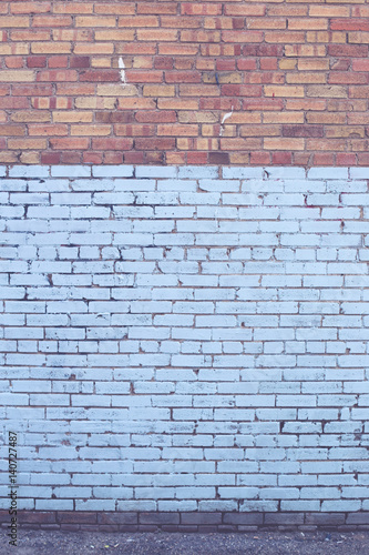 Blue and red industrial brick wall in portrait frame