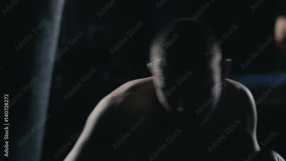 Boxer punching bag. Slow motion sequence. Boxer punching bag. Slow motion sequence.