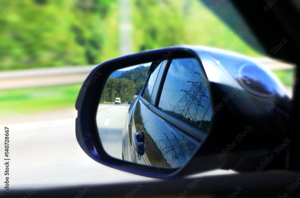 Car side mirror view with motion blur Car side mirror view with motion blur