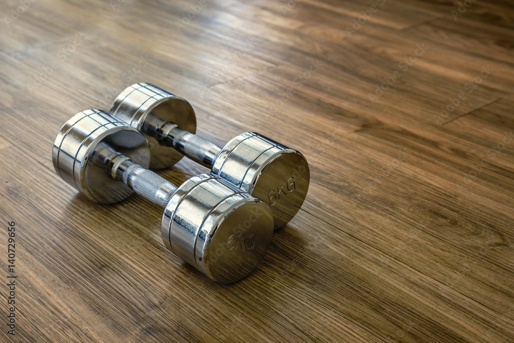 A Pair of Dumbells in a Sport Fitness Room A Pair of Dumbells in a Sport Fitness Room
