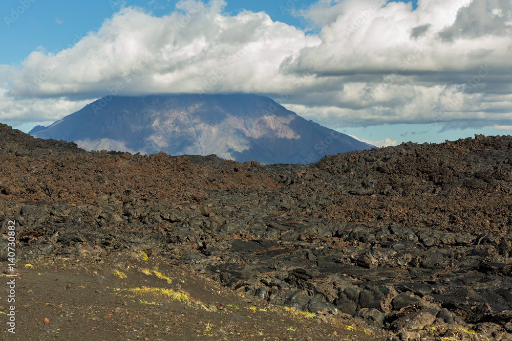 Lava field at Tolbachik volcano, after eruption in 2012 on background Big Udina volcano, Kamchatka