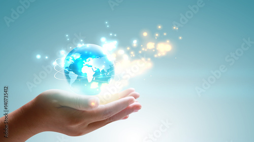 Hand holding glowing globe. World connected. Social network concept.