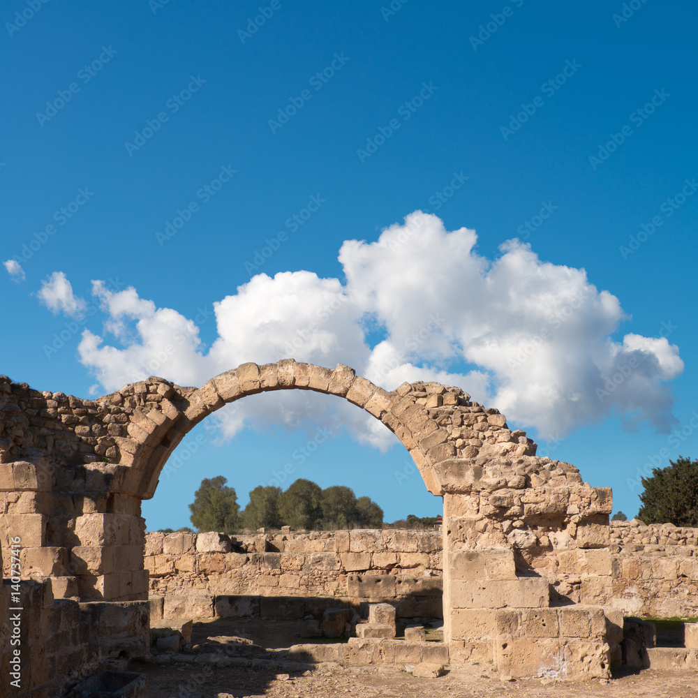 Roman arch in Paphos archaeological park in Cyprus, space
