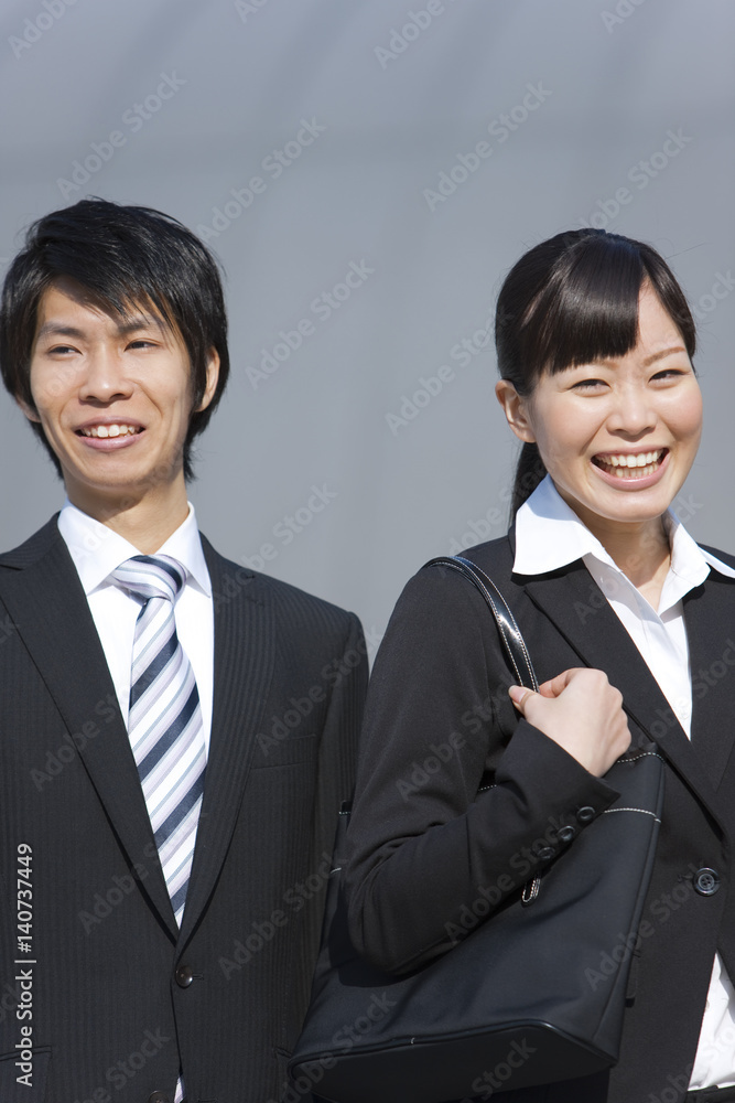 Young Businessman and Businesswoman Smiling Young Businessman and Businesswoman Smiling