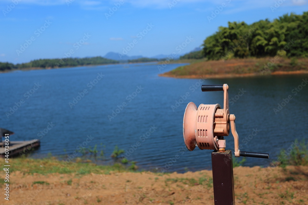 Hand Operated Siren at river, Thailand Hand Operated Siren at river, Thailand