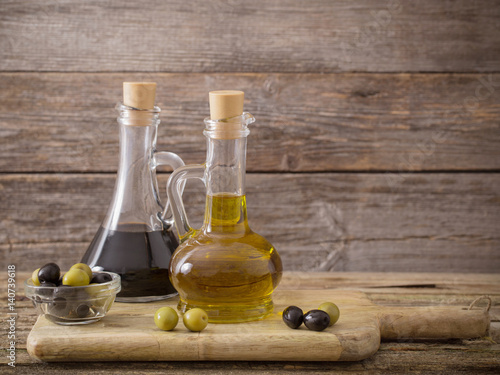 olive oil and balsamic vinegar on a wooden background