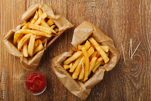 Serving Belgian fries served in a paper box. With or without a dip.