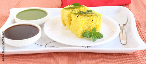 Dhokla, an Indian vegetarian food native to Gujarat state, India, in a plate.