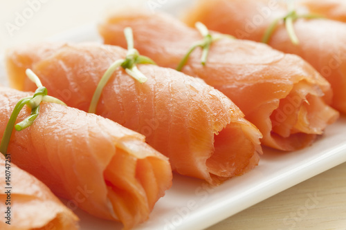 Rolls of smoked salmon as a snack