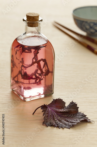 Bottle Shiso vinegar with fresh red shiso leaf