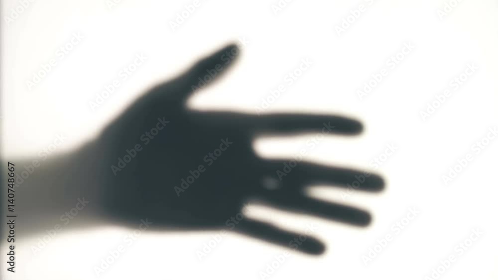 Shadow of a hand on a white background Shadow of a hand on a white background