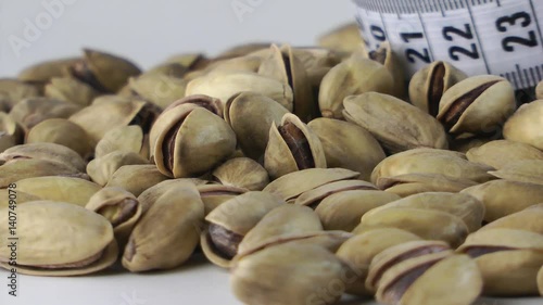 1920x1080 25 Fps. Very Nice Roasted Pistachio And Tape Measure Turning 6 Video photo