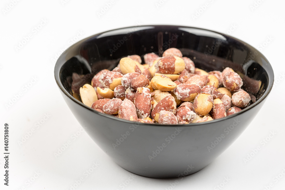 Baked saulty peanuts served in the bowl Baked saulty peanuts served in the bowl