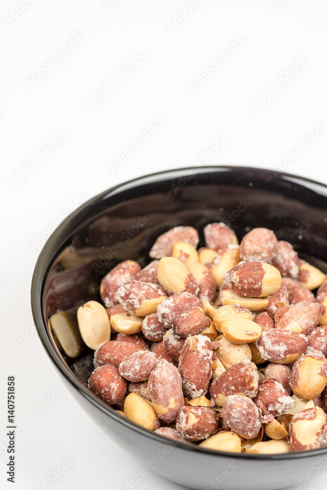 Baked saulty peanuts served in the bowl Baked saulty peanuts served in the bowl