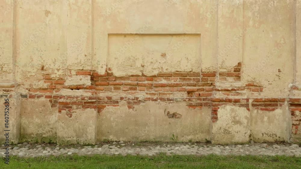 Concrete brick wall of the ancient castle. Autumn daytime. Smooth dolly shot Concrete brick wall of the ancient castle. Autumn daytime. Smooth dolly shot