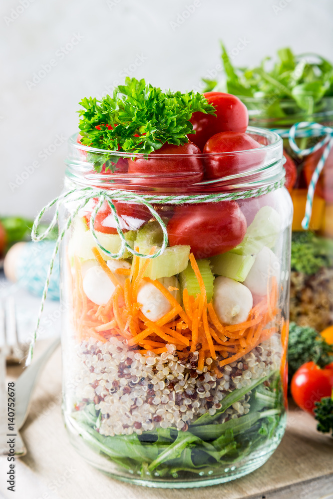 Glass jar with quinoa and vegetables salad. Healthy food, diet, detox, clean eating and vegetarian concept. Glass jar with quinoa and vegetables salad. Healthy food, diet, detox, clean eating and vegetarian concept.