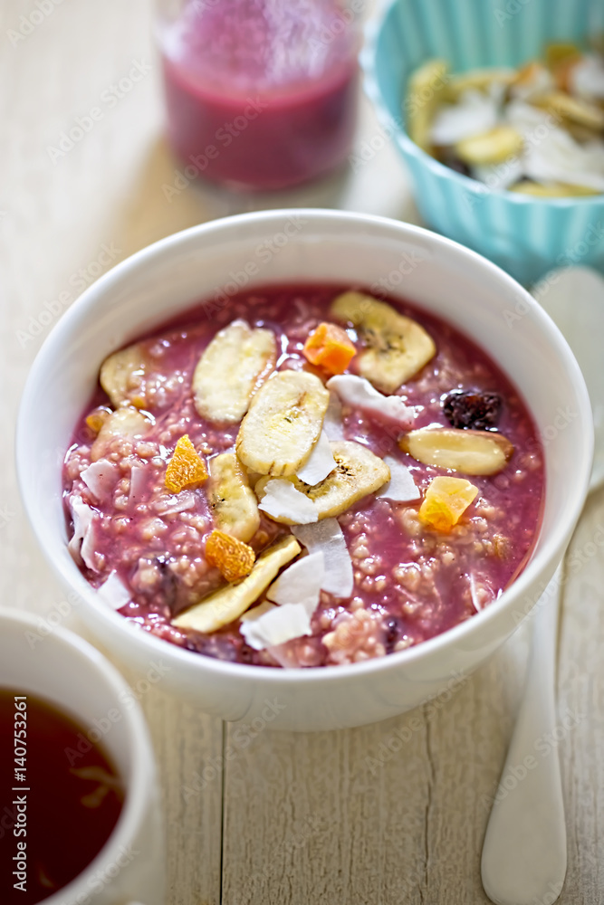 Millet grain with berry smoothie and dried fruits Millet grain with berry smoothie and dried fruits