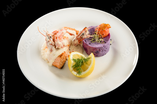 salmon fillet with champagne sauce and purple potatoes