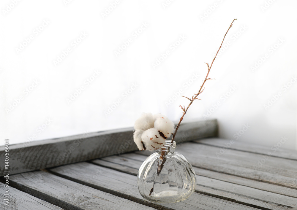 Branch of cotton on the wood table
