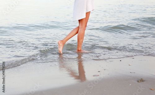 beach travel woman walking on sand beach