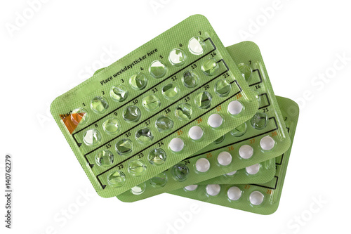 Stack of Birth control pill in 28 pill packages. There are emptied 24 hormone pills and left over 4 placebo non-hormone pills, isolated on white background