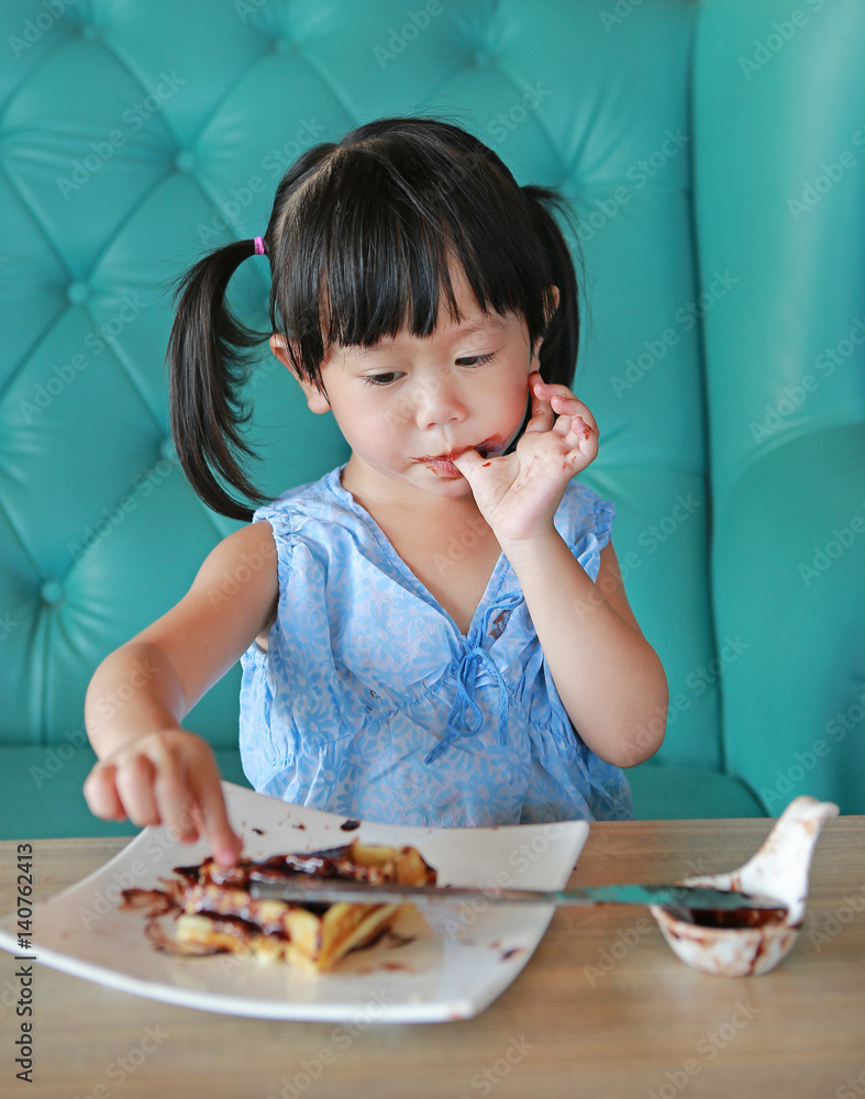 Portrait child girl eating ice cream waffles Portrait child girl eating ice cream waffles