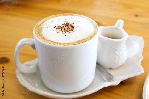 Hot coffee in a white cup o...