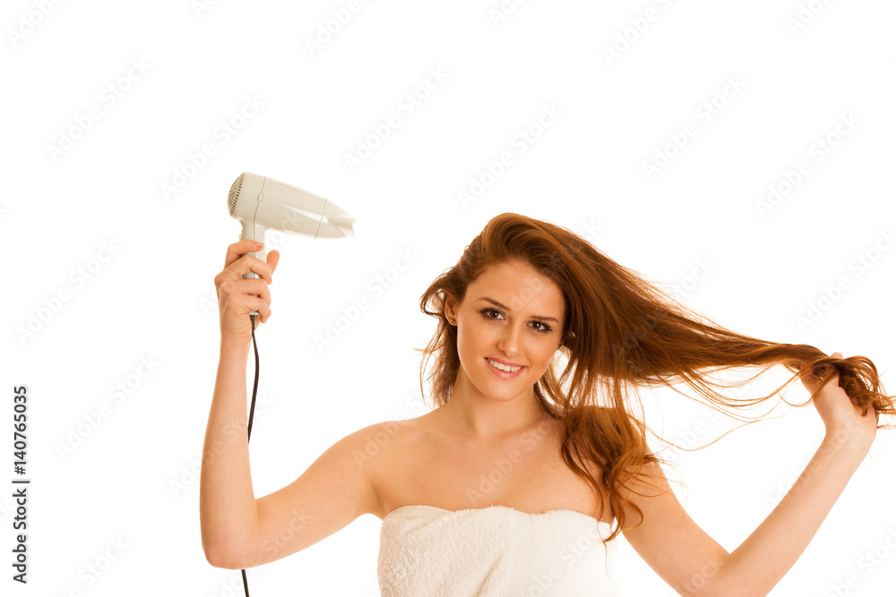 beautiful young woman dries hair with a blow dryer beautiful young woman dries hair with a blow dryer