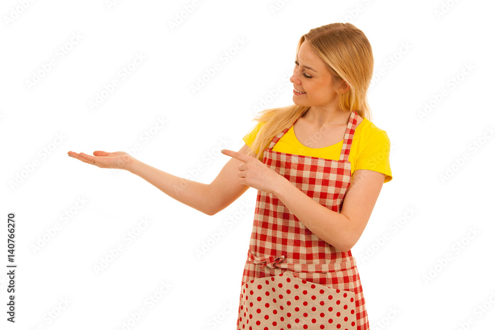 Young woman cook points to copy space as she presents new recepy Young woman cook points to copy space as she presents new recepy