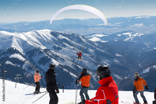 paragliding on skis, winter holiday activity, Chopok, Slovakia photo