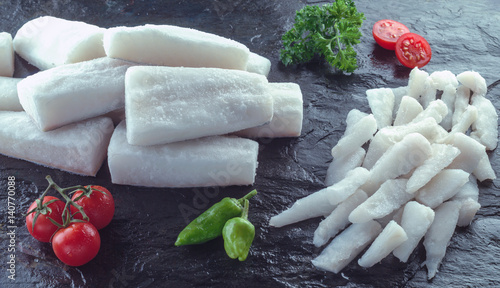 loins and slices of frozen codfish photo
