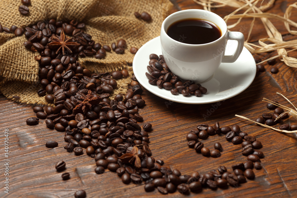 Naklejka premium White cup of coffee with beans