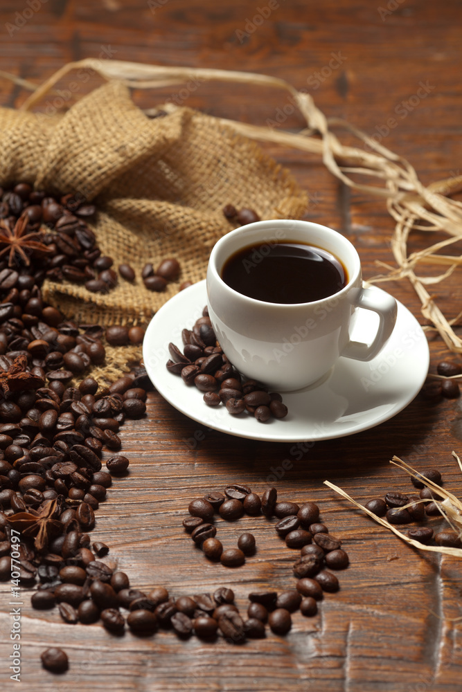 Obraz premium White cup of coffee with beans