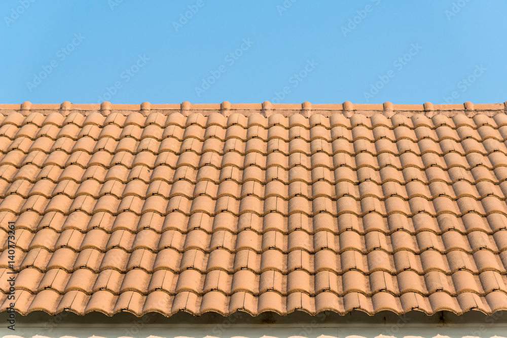 Fototapeta premium Modern tile roof with blue sky
