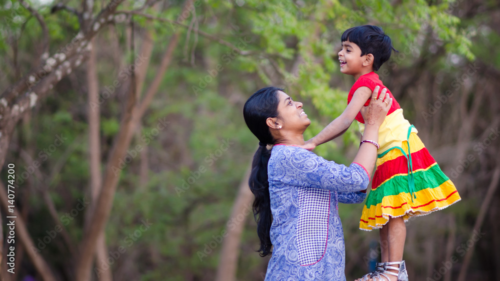 Fototapeta premium Mother and daughter in playful mood